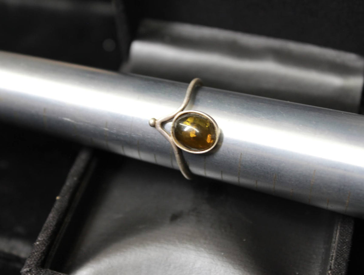 Elegant Silver Ring with Amber-Like Stone